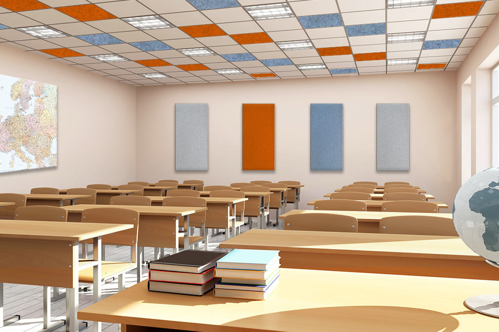 Classroom with tables, a globe and sound-absorbing elements on the wall as well as square acoustic elements in various colors, suitable for standard grid ceilings.