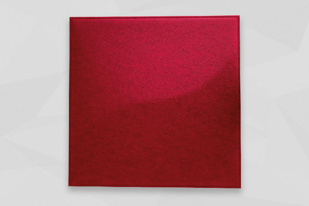 A soni COLOR Design YinYang ceiling element in red photographed against a light gray background.
