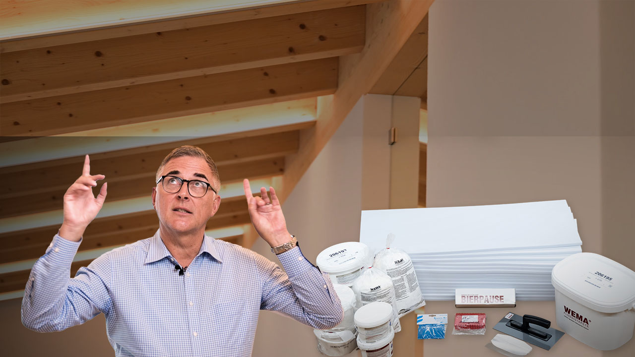 Thumbnail Man points to the ceiling, which is fitted with Silence Pro acoustic wallpaper