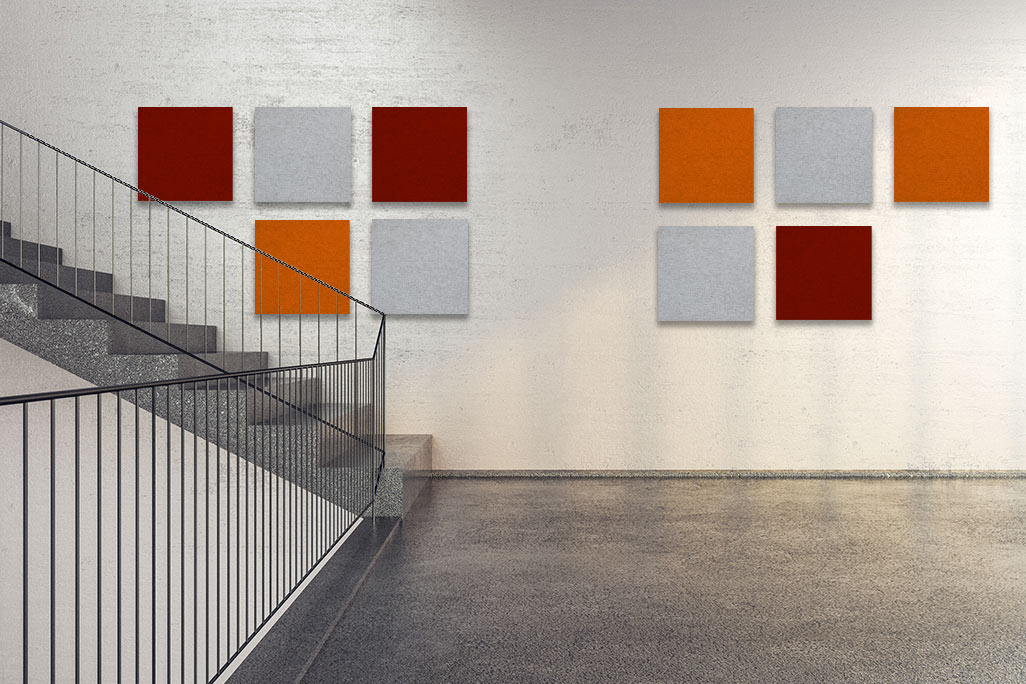 Clean, bright stairwell with square, colored acoustic elements on the wall.