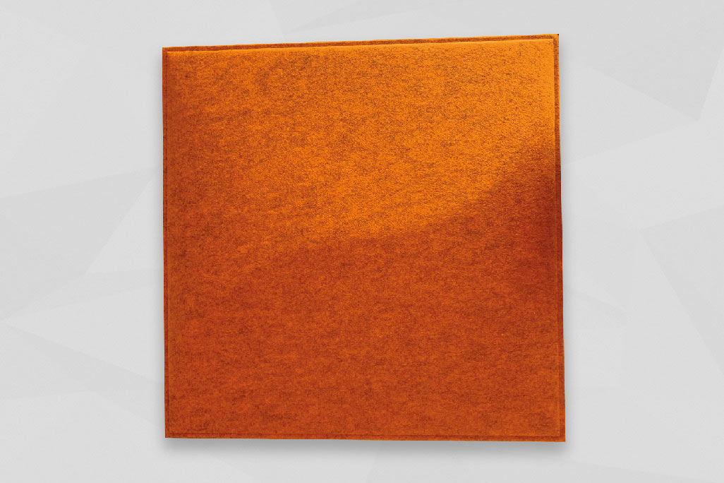 A soni COLOR Design YinYang ceiling element in orange photographed against a light gray background.