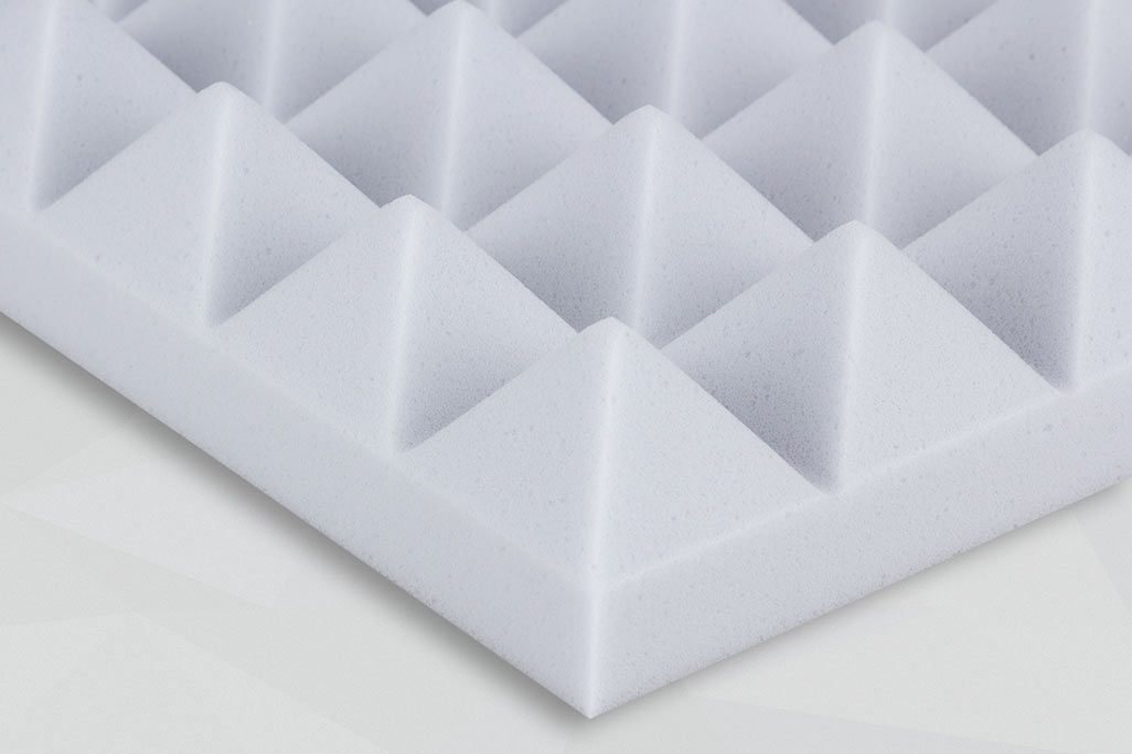 Cut-out of a melamine foam panel in pyramid shape for sound absorption