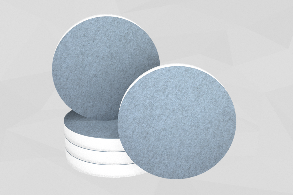 5 sound absorbers in the shape of a circle (soni ELEMENT CIRCLE) neatly stacked and upright in the color blue against a grey background.